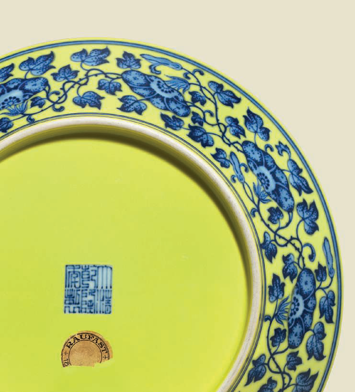 A large finely painted yellow-ground blue and white 'Nine Peaches' dish, Qianlong six-character seal mark in underglaze blue and of the period back)