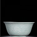 A fine and rare massive carved celadon-glazed 'fruit' bowl, seal mark and period of yongzheng (1723-1735)