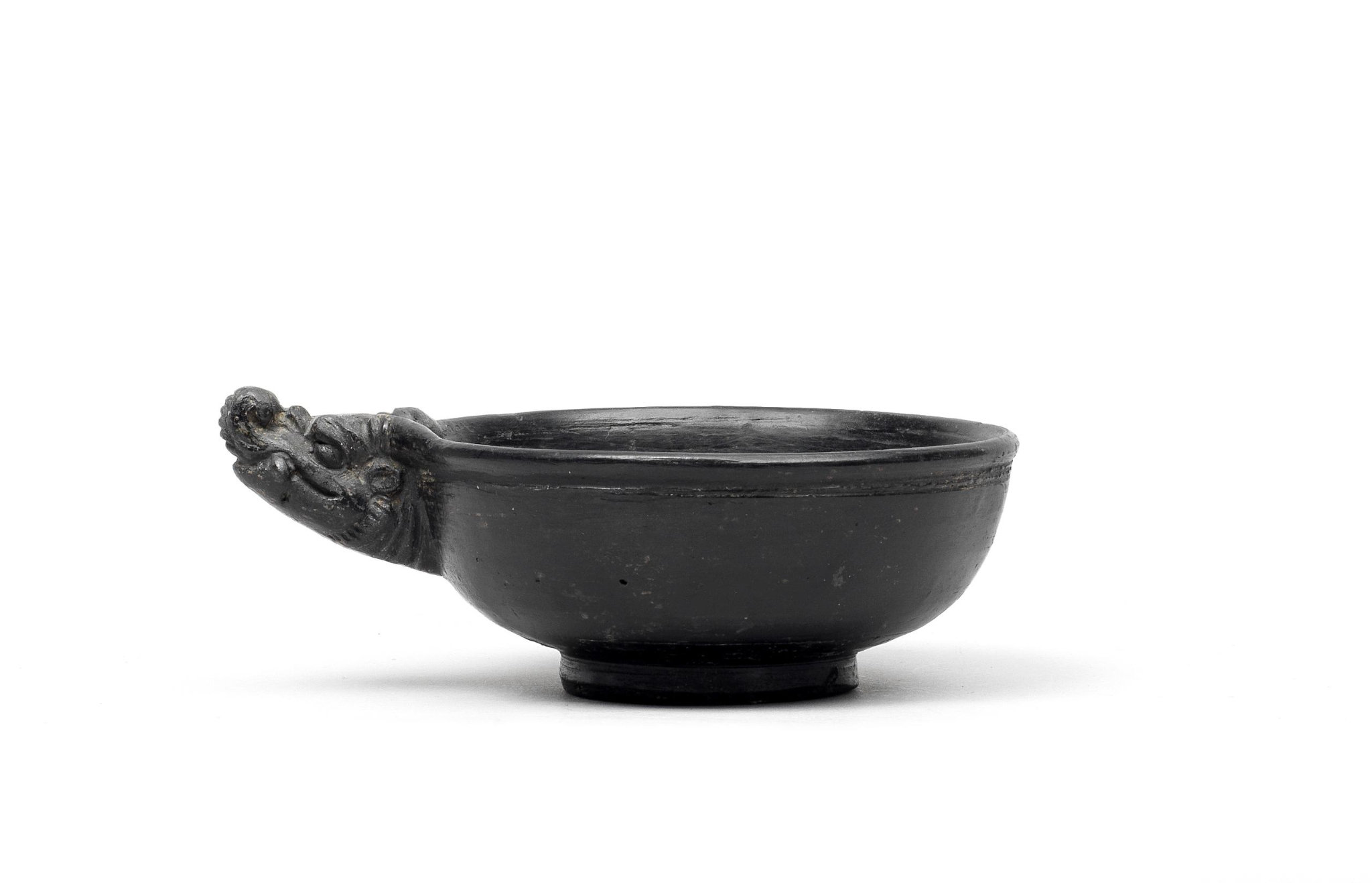 A rare black-glazed 'dragon' cup, Yuan dynasty (1271-1368)