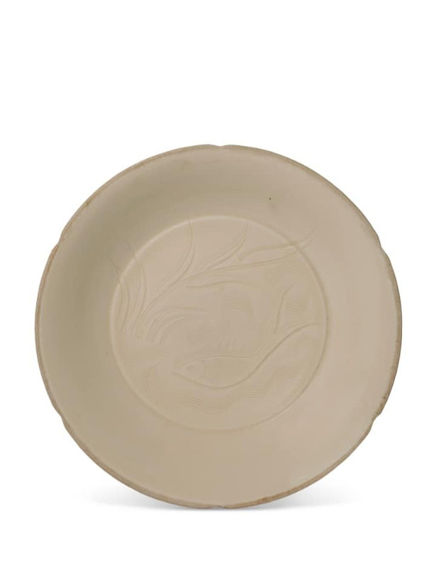 A finely carved and incised Ding 'fish' dish, Northern Song dynasty (960-1127)