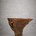 An exceptionally well-carved rhinoceros horn libation cup, qing dynasty, 18th century