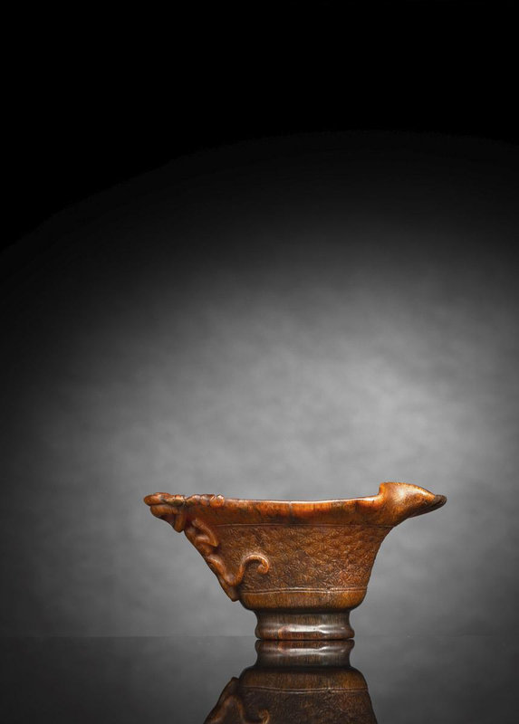 A light brown colored rhinoceros horn libation cup with chilong handles, China, 17th-18th century