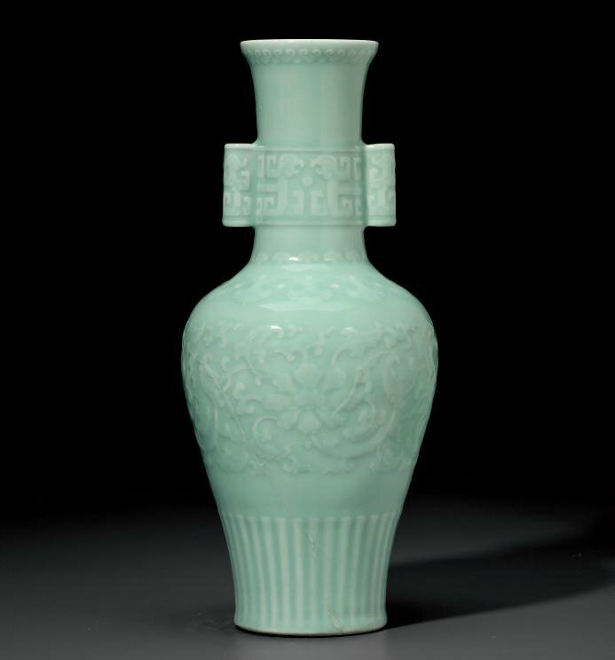 A rare celadon-glazed relief-decorated baluster vase, Qianlong six ...