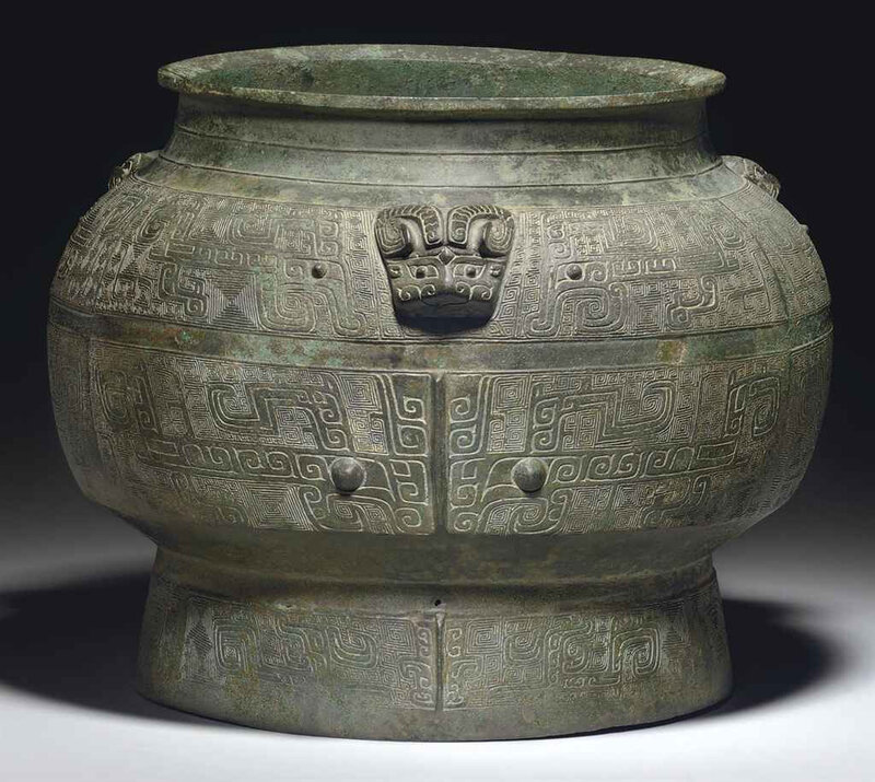 A rare and finely cast large ritual bronze wine vessel, pou, Shang dynasty, 11th century BC