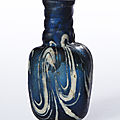 Flacon of blue glass with marvered white-thread decoration, egypt or syria, 8th-9th century