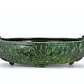 A finely carved spinach-green jade marriage bowl, qing dynasty, qianlong period (1736-1795)