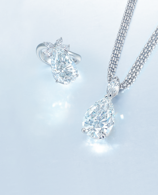 A diamond pendant necklace and a diamond ring