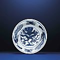 A fine small blue and white 'dragon' bowl, wanli six-character mark within double circles and of the period (1573-1619)