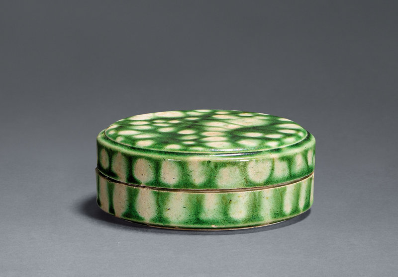 A green-glazed applique-decorated box and cover, Tang dynasty, 7th-10th century