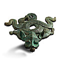 An archaic bronze 'mythical beast' stand, eastern zhou dynasty (770-221 bc)