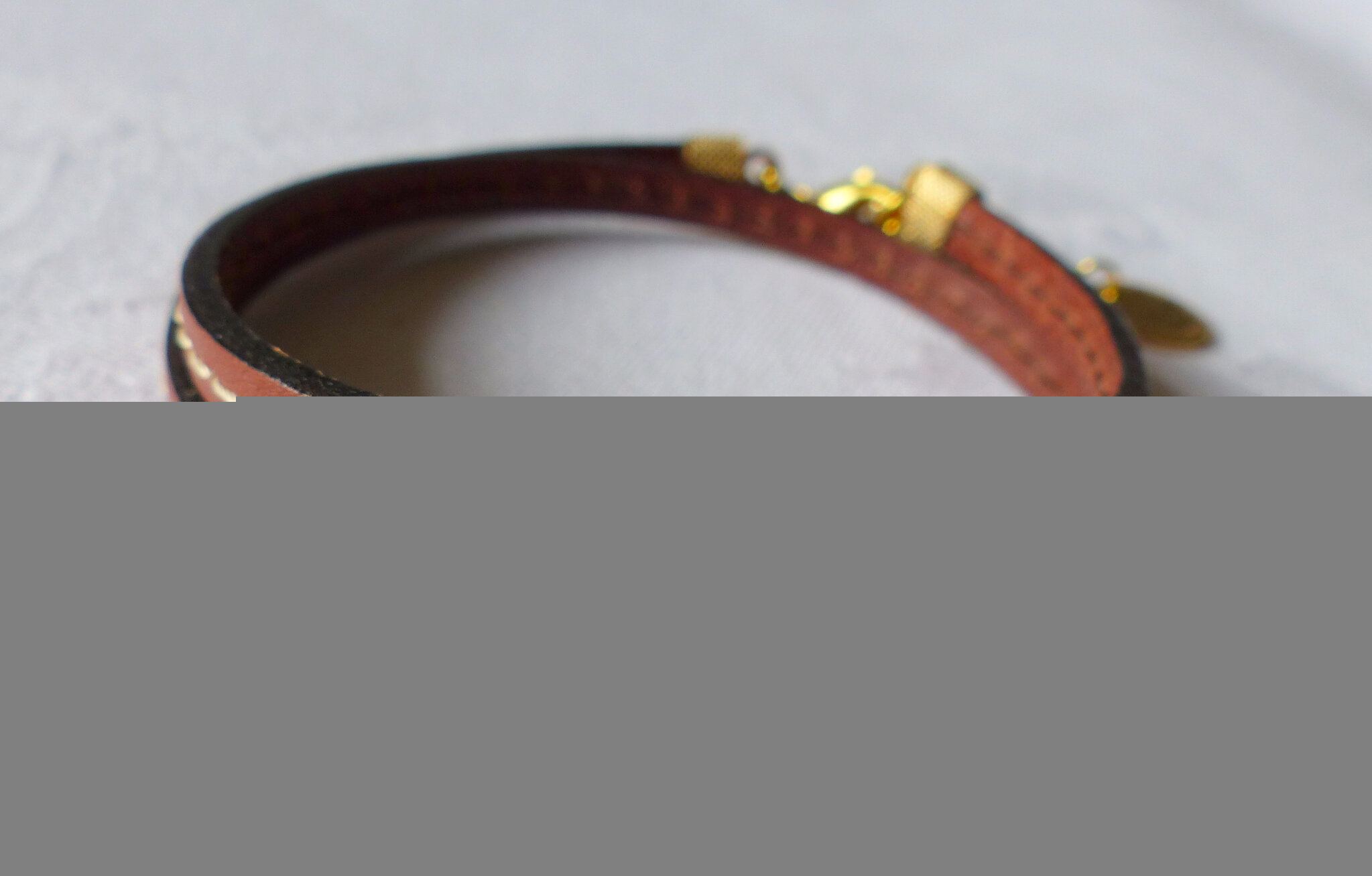 Bracelet Cavalière doré double (brun) - 24 €