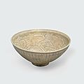 An olive green glazed bowl with carved and combed decoration, trần dynasty, 13th-14th century