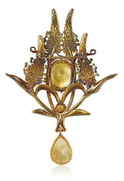 An Art Nouveau coloured sapphire, citrine and enamel brooch, by