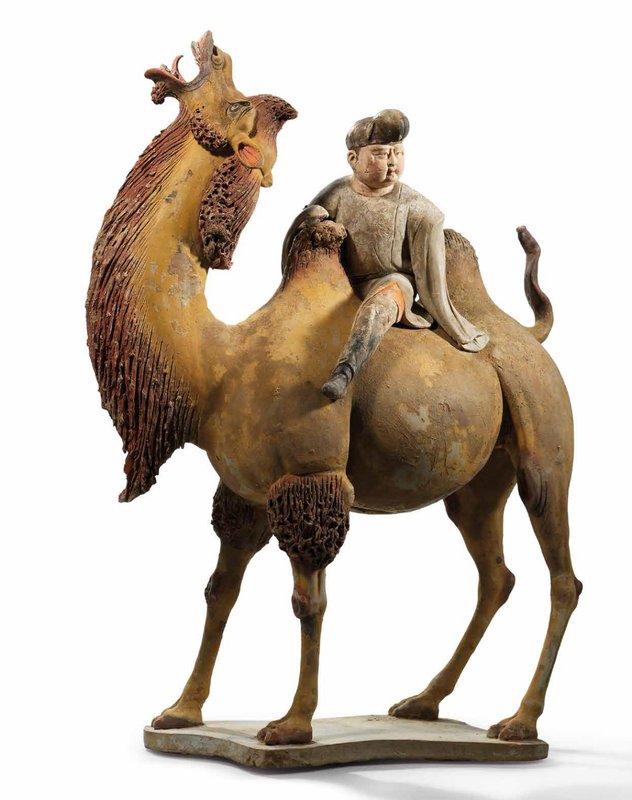 A finely painted pottery figure of a Bactrian camel and rider, Tang dynasty (618-907)