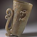 Cup (guang) in the form of a rhyton with mask, dragon, and scrollwork, china, middle or late ming dynasty, about 1450-1644