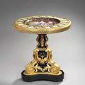 Guéridon, d’une paire de style louis xvi, porcelaine de sèvres, bois noirci et bronze doré, signé 