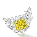 Impressive diamond and 59.88 carats, si1 clarity, treated fancy vivid yellow diamond brooch