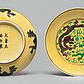 A pair of yellow-ground green and aubergine-enameled 'dragon' dishes, guangxu marks and period