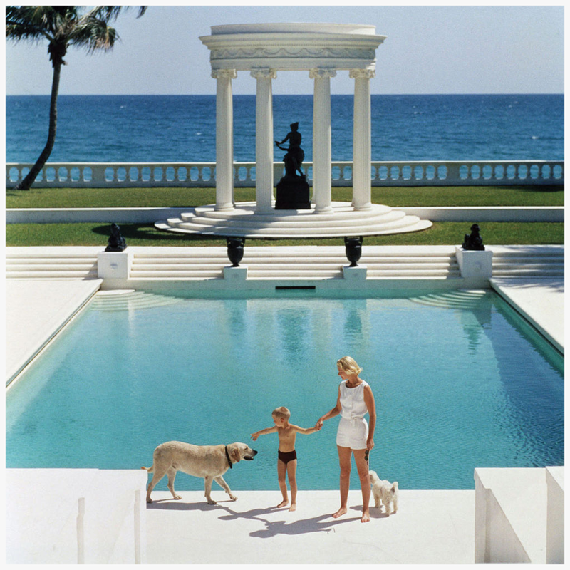 mrs-f-c-winston-guest-aka-cee-zee-guest-and-her-son-alexander-michael-douglas-dudley-guest-in-front-of-their-grecian-temple-villa-artemis-palm-beach-photo-slim-arons-1955
