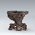 A large rhinoceros horn 'chilong and pine tree' libation cup, qing dynasty, 17th-18th century