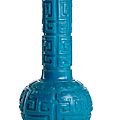 A deep cut turquoise-blue beijing glass bottle vase with dragon decoration, engraved qianlong four-character mark, 18th-19th ct